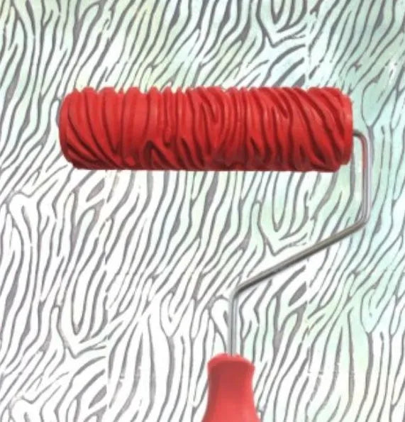 Red 7-inch paint embossing roller with textured rubber surface for creating wall patterns