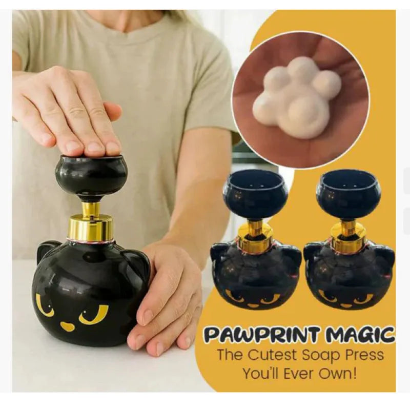 Black cartoon cat-shaped plastic foam soap dispenser on a bathroom counter.