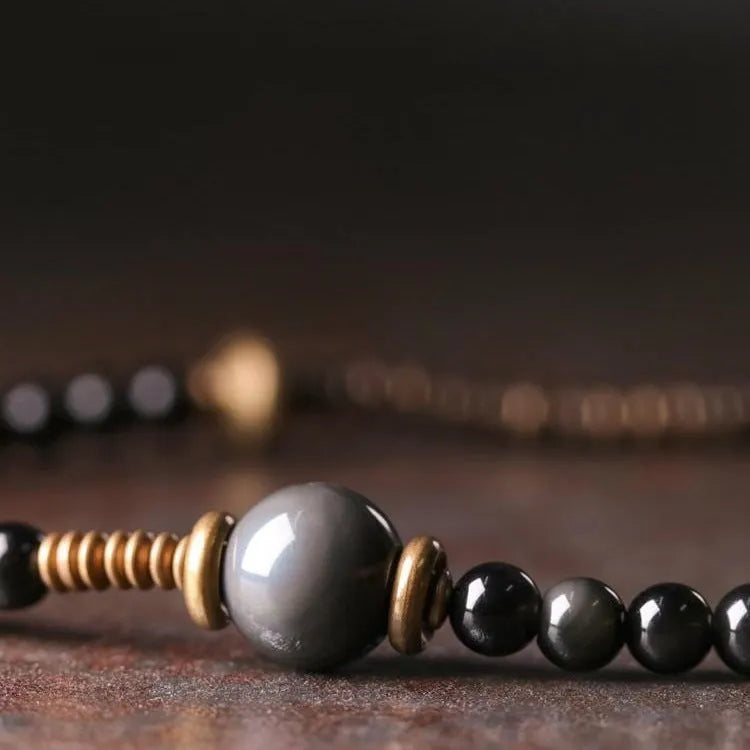 Black geometric multi layered bead bracelet with retro colourful beads on adjustable strap