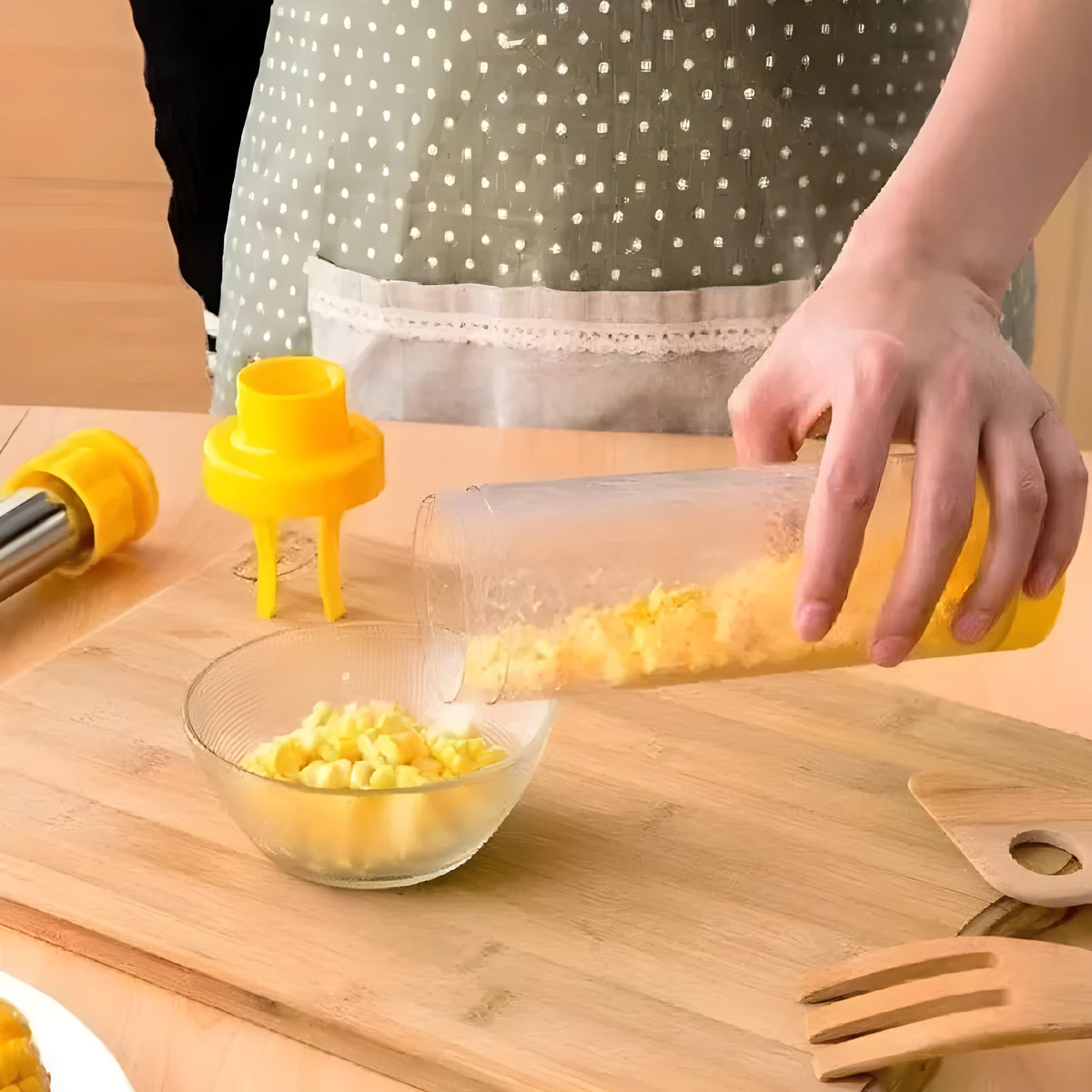 Yellow cylindrical corn stripper with stainless steel blades and ABS plastic housing