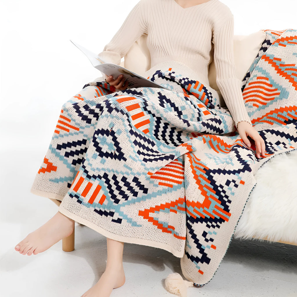 Bohemian-style acrylic sofa cover blanket with tassel trim in a geometric pattern colour option