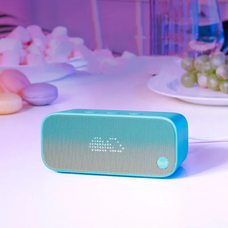 Elf Sugar Cube Artificial Intelligence Speaker in blue, green, red, or white colours showing compact plastic housing