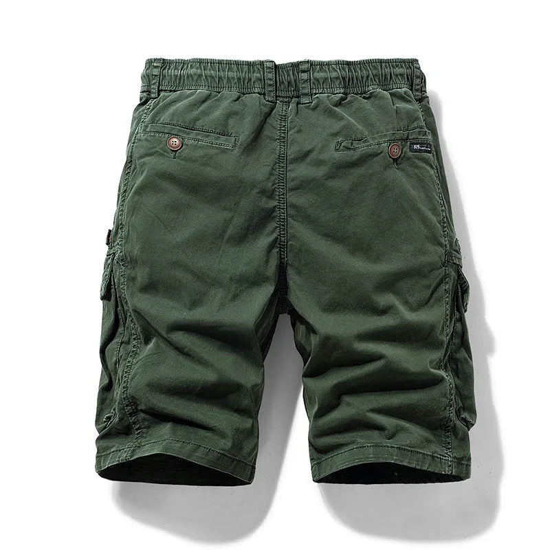 Men's army green cotton shorts with multiple pockets and a zipper, showing Korean summer style.