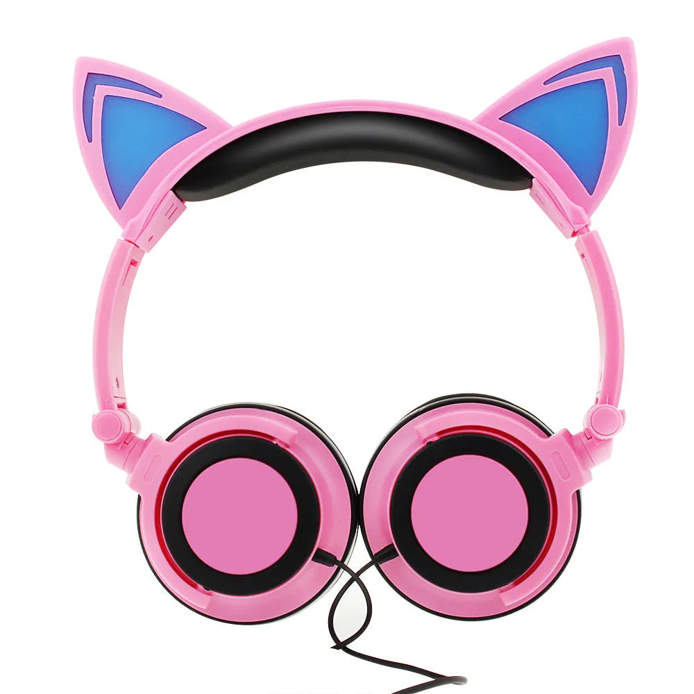 Black cat ear headphones with glowing pink LED lights on the ears and ear cushions.