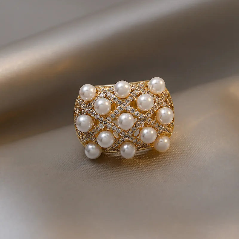 Copper zircon pearl geometric ring with 14K gold electroplated finish and adjustable opening for women.