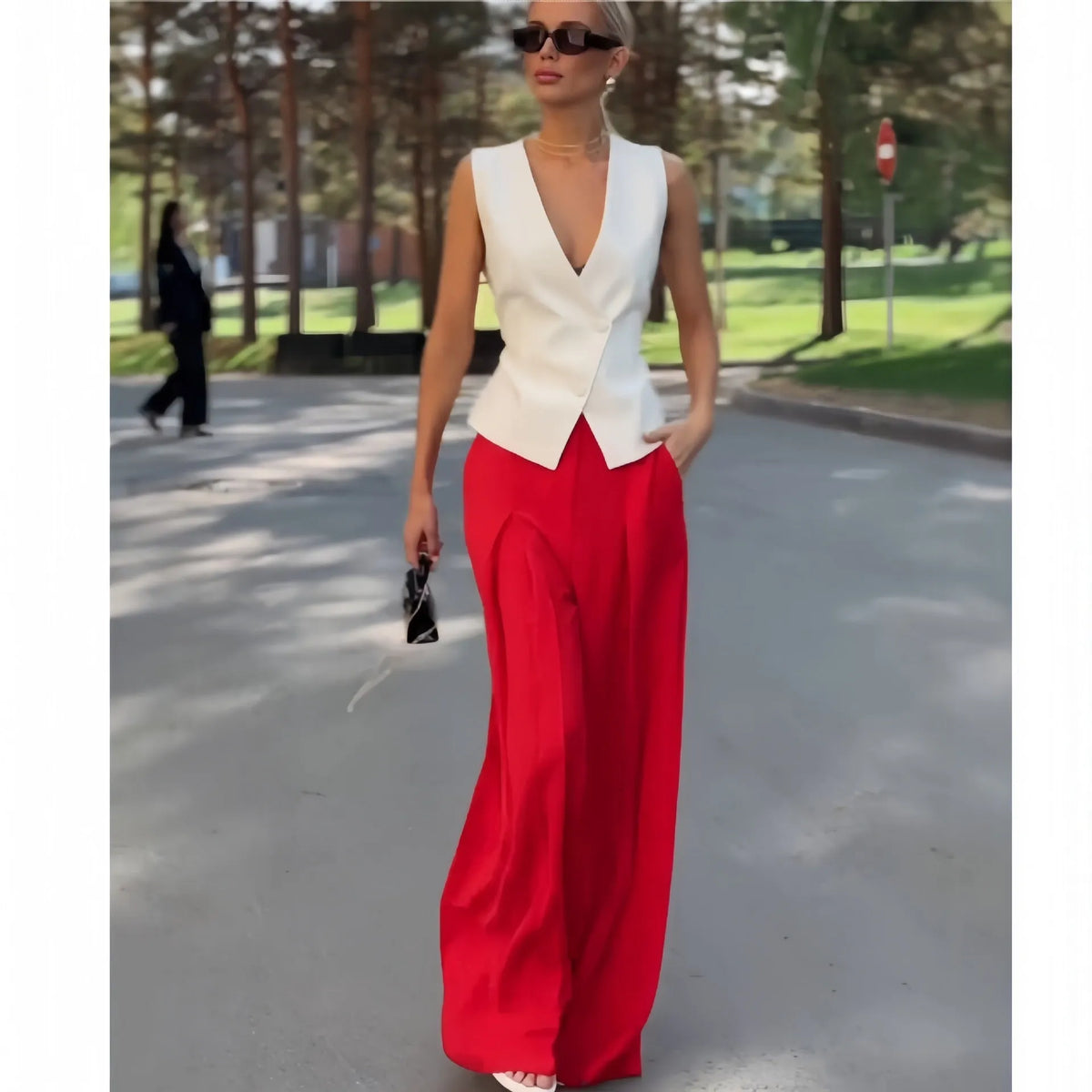 Women's beige polyester two-piece set with sleeveless deep V-neck top and wide-leg trousers