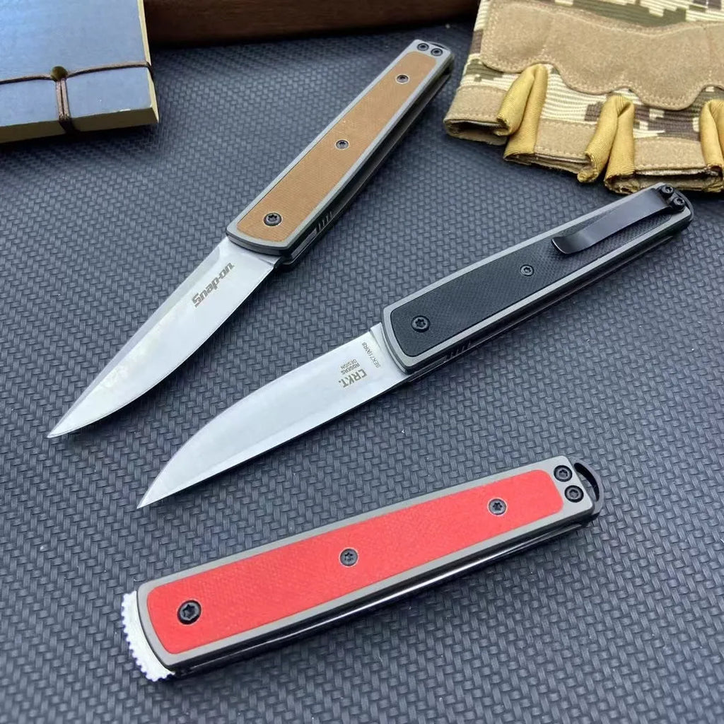 Folding fruit knife with stainless steel blade showing black, coffee colour, and red handle options