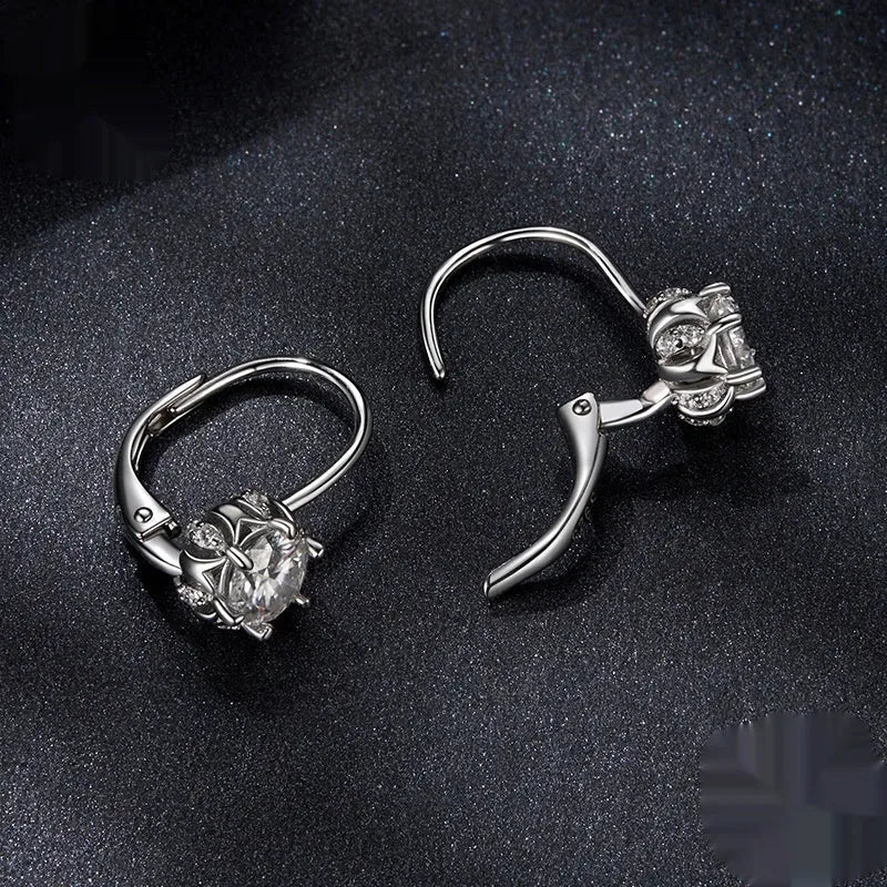 Sterling silver flower bud clip earrings with white gold plating and 0.5 carat moissanite stone