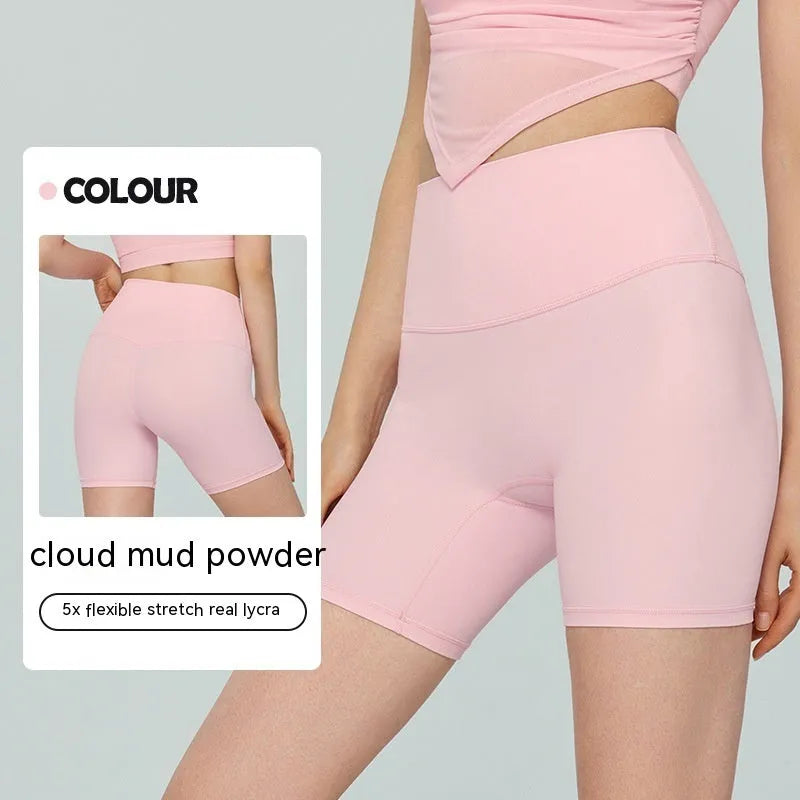 Women's high waist Lycra yoga shorts in leaf green colour, short length for fitness.