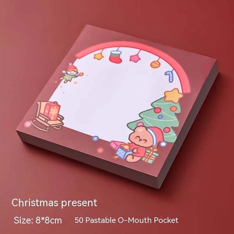Christmas cartoon sticky notes pad with festive designs including Santa Claus and snowman