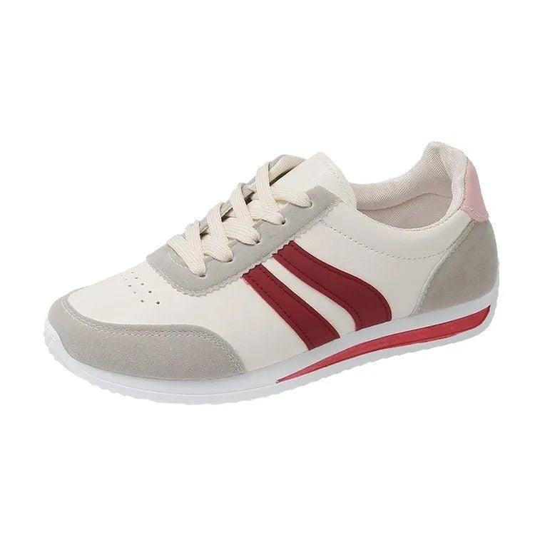 Red and blue low-top lace-up leisure sneakers with round toe and rubber sole.