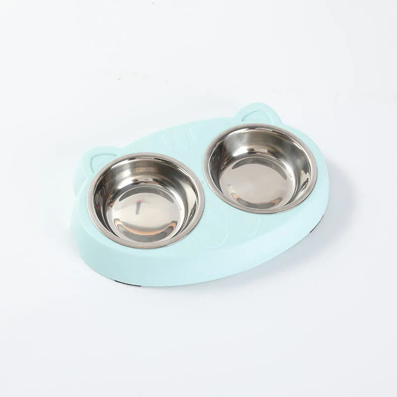 Blue Macaron double bowl plastic pet feeder for cats and dogs on a floor.