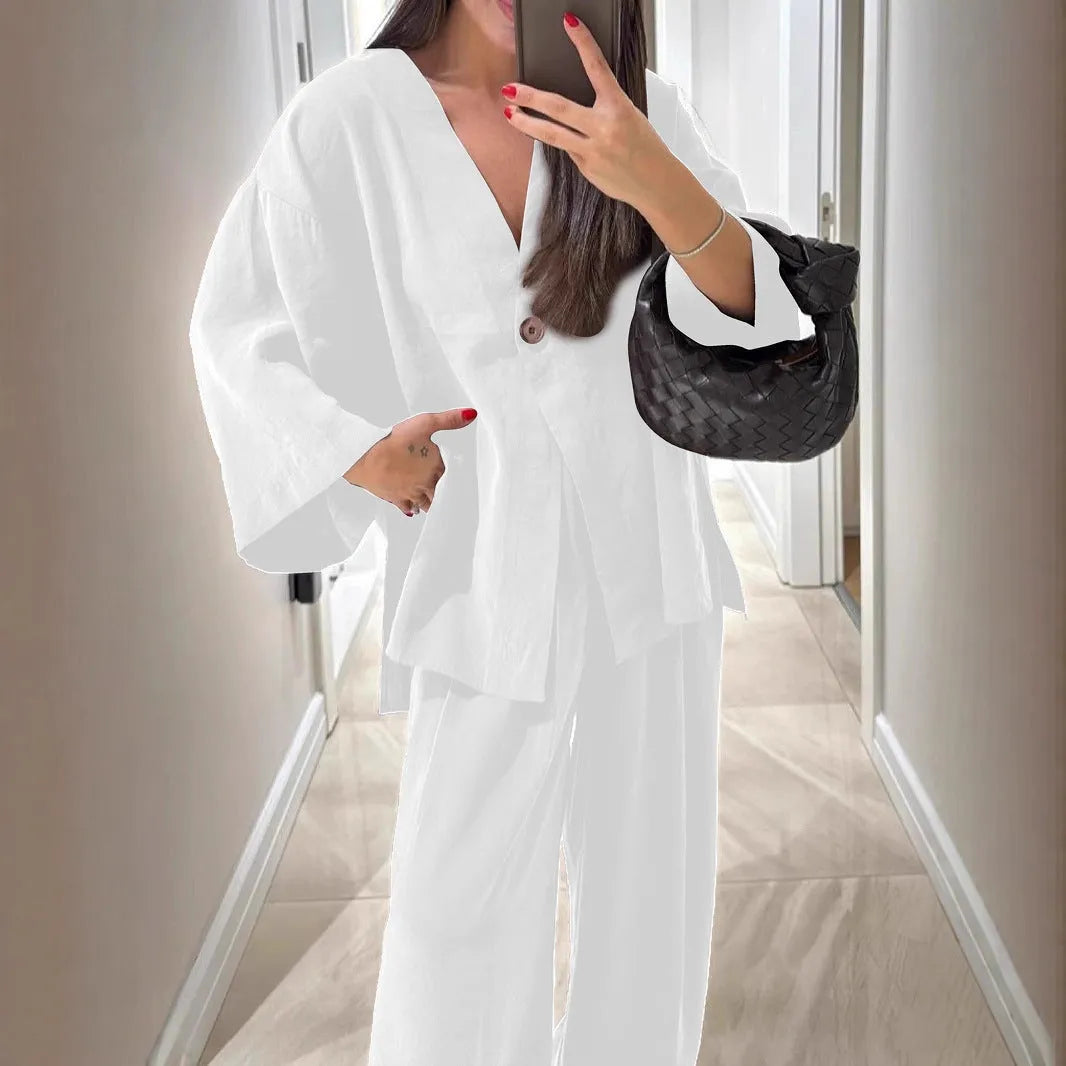 Women's solid colour two-piece set with long sleeve cardigan top and matching trousers, zip and button front, sizes S to XXL