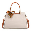 Milky white women's PU leather large-capacity shoulder handbag with internal organisers.