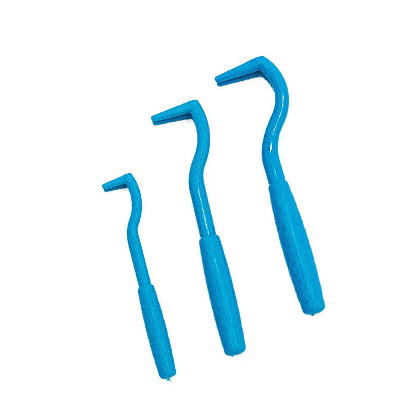 Set of three blue or green plastic tick removal hook tools for pets on a white background.