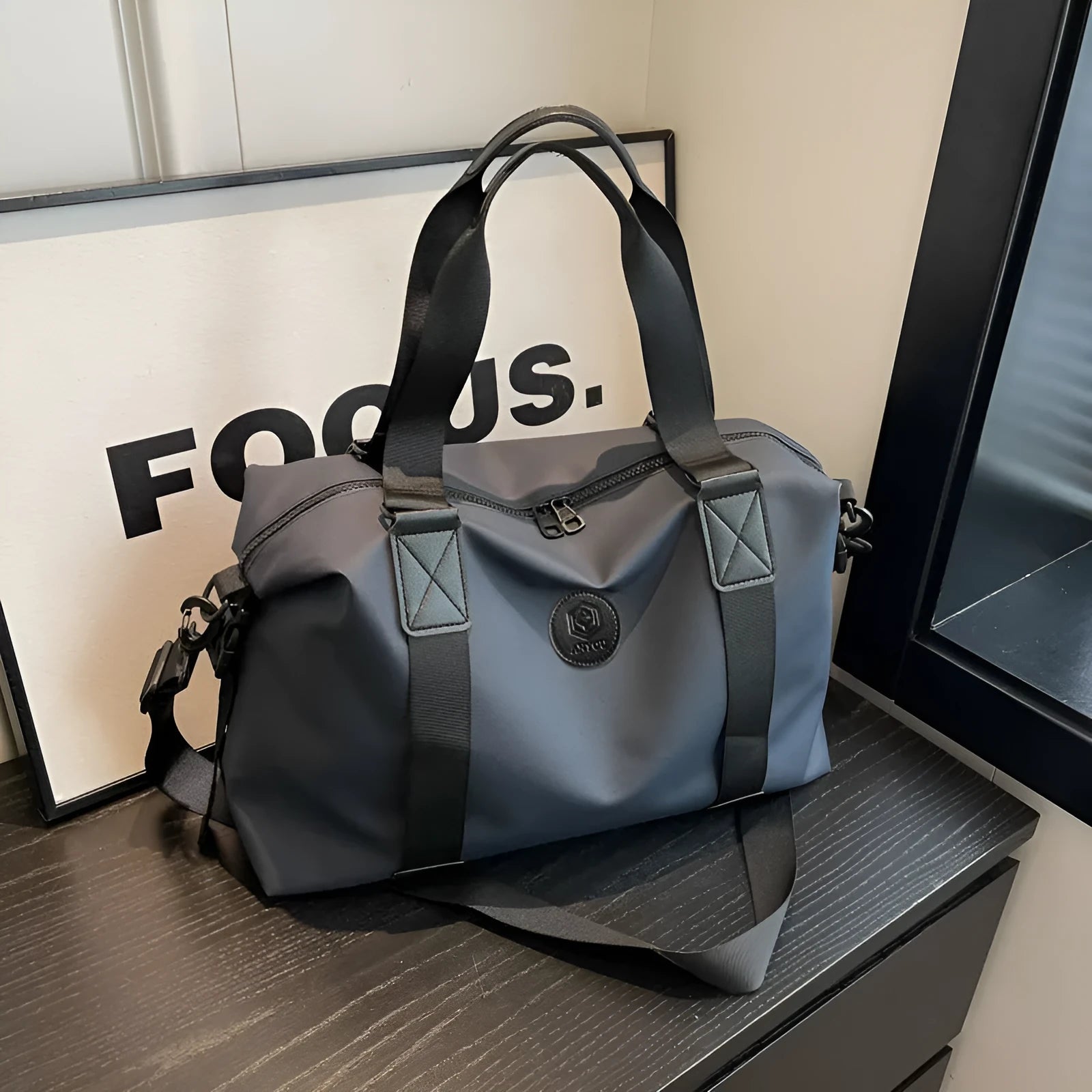 Large black waterproof Oxford cloth travel backpack with multiple compartments shown on a grey background.
