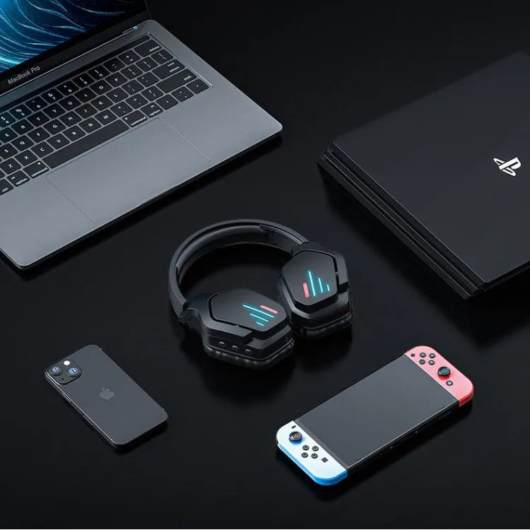 Luminous black wireless head-mounted stereo headphones with ear cups and headband on a grey background.