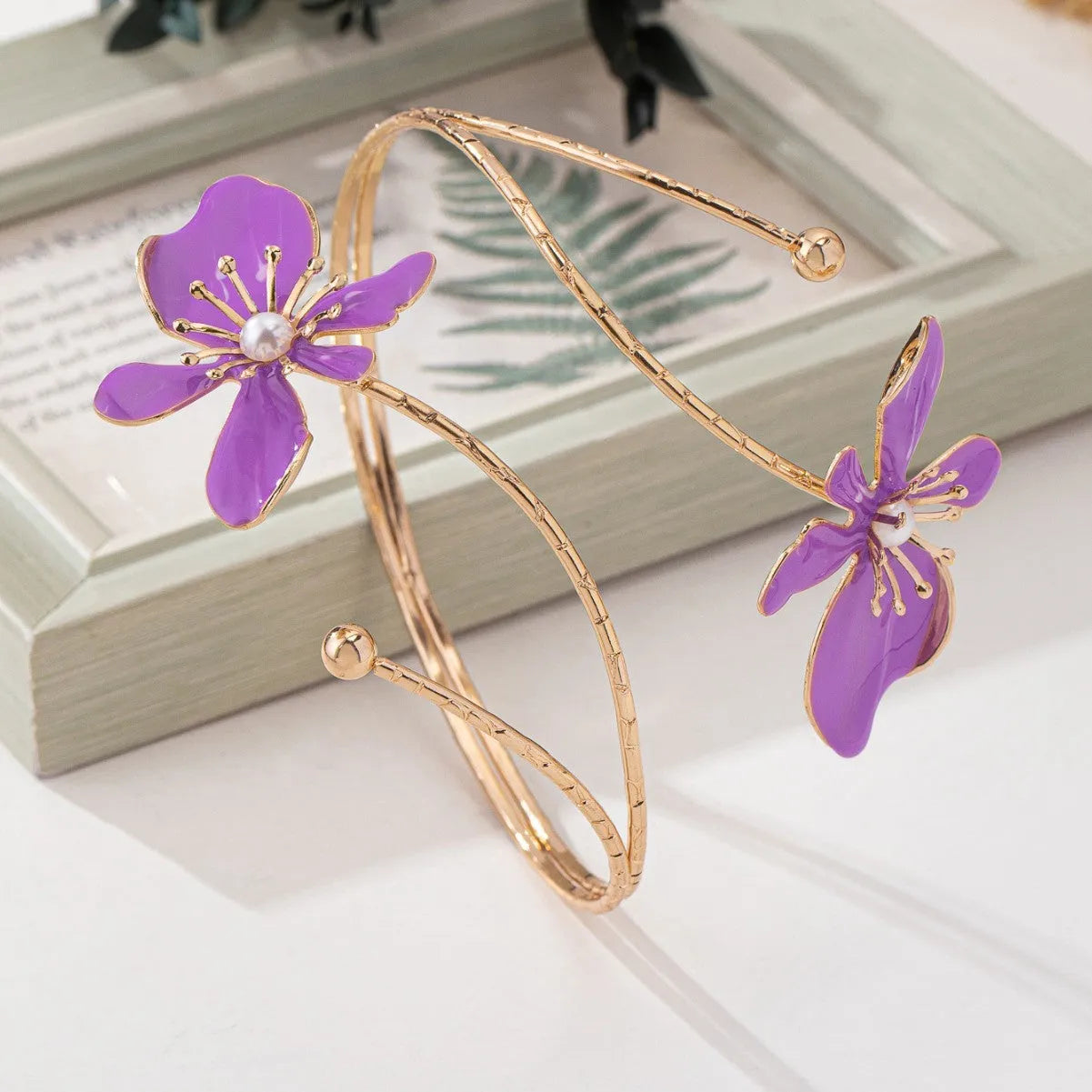 Alloy hollow armband with fashion pattern designs in pink or purple colour options