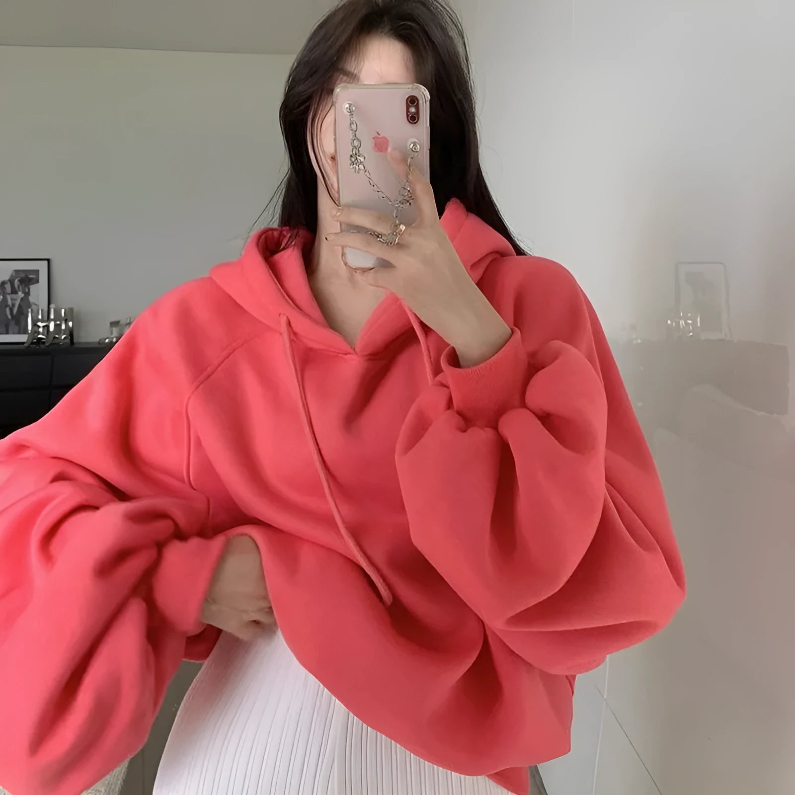 Watermelon red women's mulberry silk hooded sweater with sleeveless design on hanger