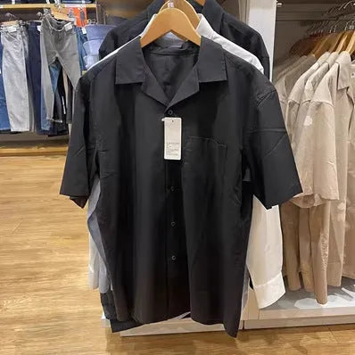 Man wearing a beige open collar modal cotton blend casual shirt with regular sleeves.