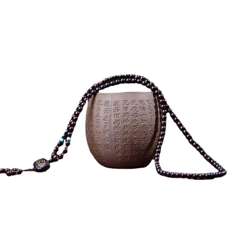 Zambia rosewood Buddha bead bracelet with flat lotus pendant, showing 108 wooden beads.