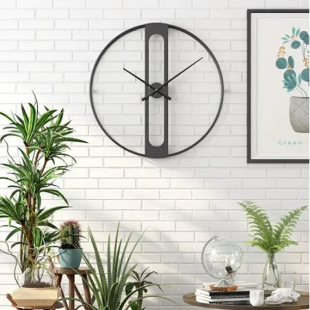 Round metal wall clock showing black and gold colour options, 50cm in diameter.