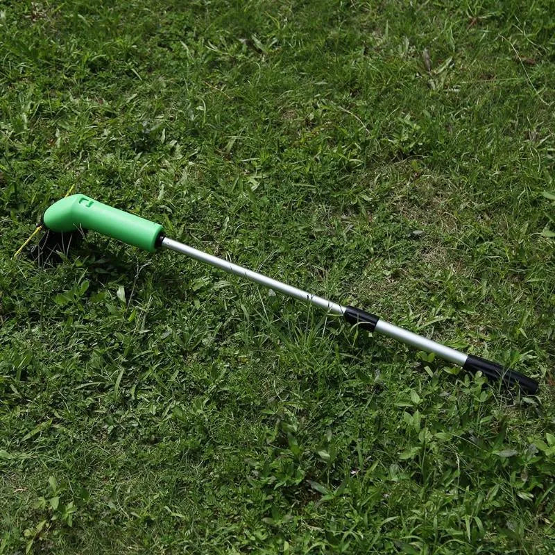Cordless Zip Trim lawn trimmer with extension pole and protective shield on a garden lawn