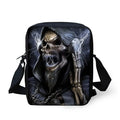 A medium-sized black children's messenger bag with a white skull print, showing a front zipper pocket and a soft top handle.