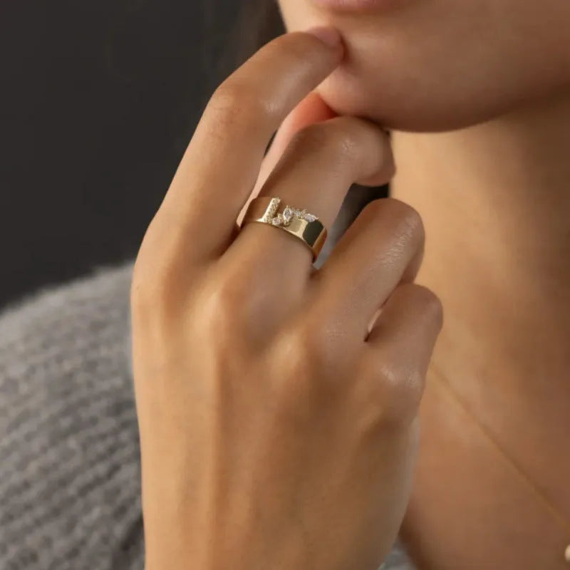 Gold-colour women's ring with zircon detailing showing electroplated finish and sizing options