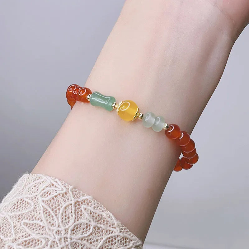 Red agate bracelet with Chinese lucky bag design and dragon motifs for women