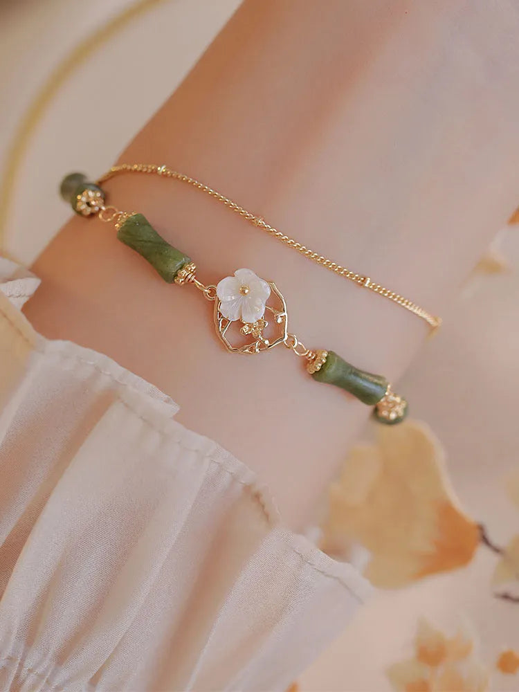 Natural olivine double layer bracelet with twin Bells of Ireland charms and olive branch design elements