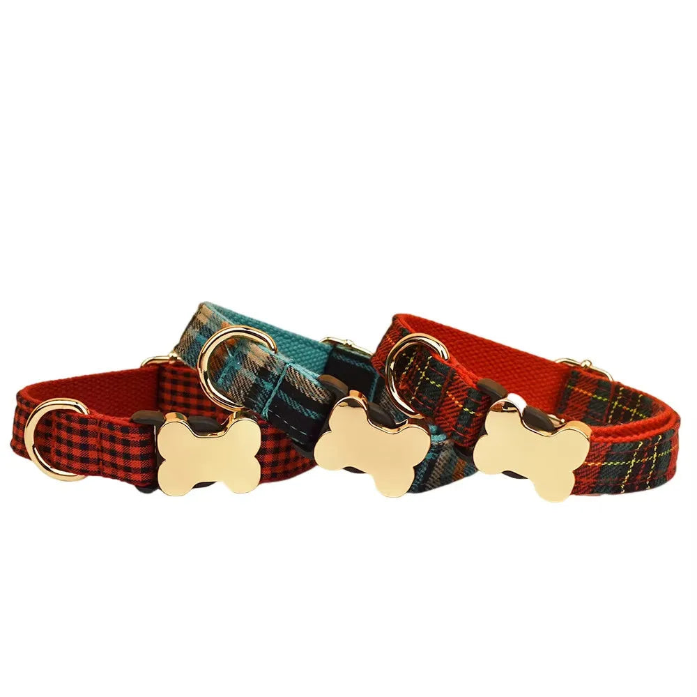 Flat nylon dog collar with a grid print and a silver bone-shaped metal buckle on a green background.