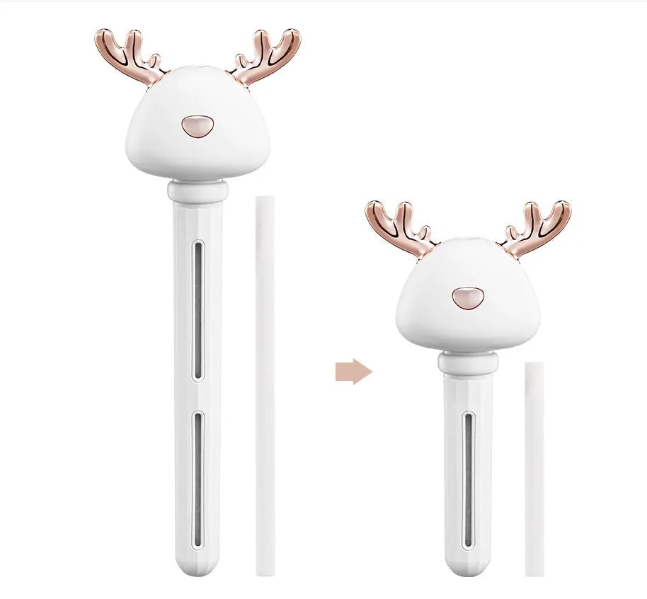 Mini USB portable car humidifier with creative little antler design in beige, showing water tank filler and USB cable