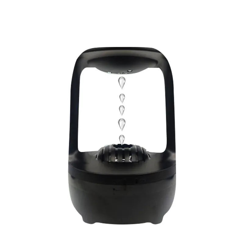 White anti-gravity humidifier showing water drop backflow effect with USB cable connection