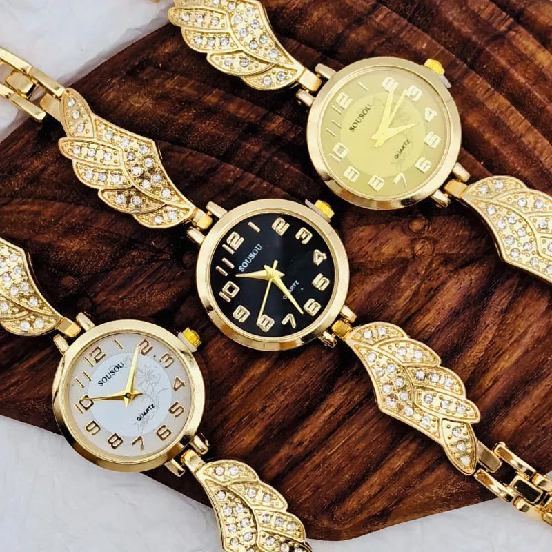 Round stainless steel women's watch with gold dial surface and Vachette clasp buckle