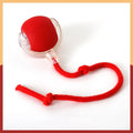 Silicone cat rolling ball toy with plush attachments in red, green, and grey colours