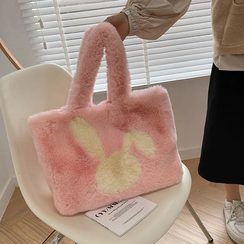 Cartoon rabbit ears design on a solid colour plush tote bag for women.