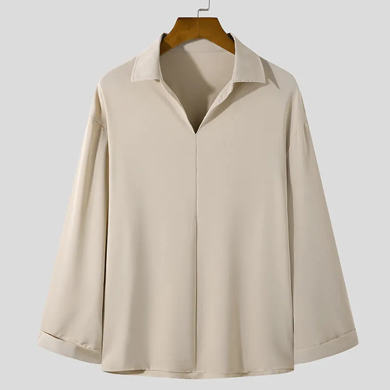 Men's loose lapels casual long sleeve shirt in a solid colour on a hanger.