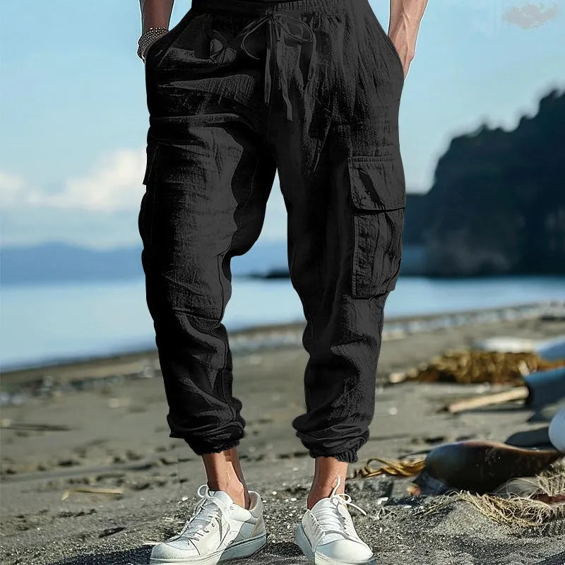 Men's linen casual trousers with ankle drawstring and multiple pockets in solid colour