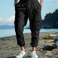 Men's linen casual trousers with ankle drawstring and multiple pockets in solid colour
