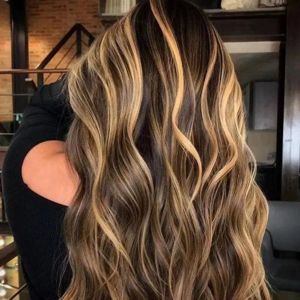 Front lace synthetic wig with long curly hair and side bangs in a piano colour.