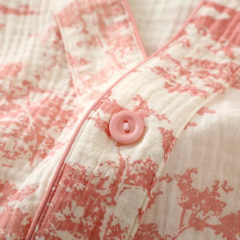 Women's cotton gauze loungewear set showing long sleeve shirt and matching trousers with lace-up detail in pastel colour