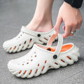 Men's beige EVA slipper sandals with hollow-out design and non-slip sole, shown from the side.