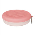 Collapsible silicone dog bowl in pink and green colours, shown both open and folded flat