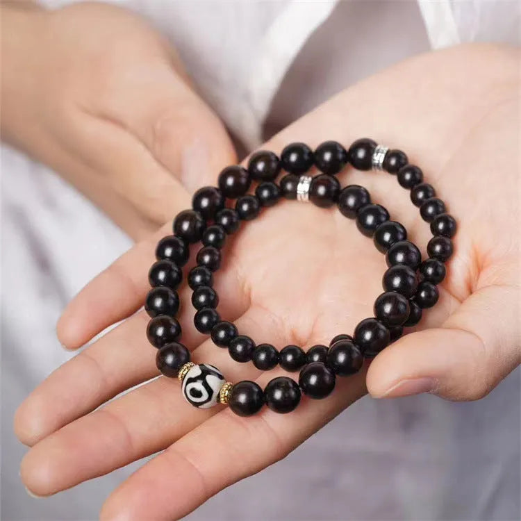 Ebony wood bracelet with 8mm diameter and two circles of beads in retro style
