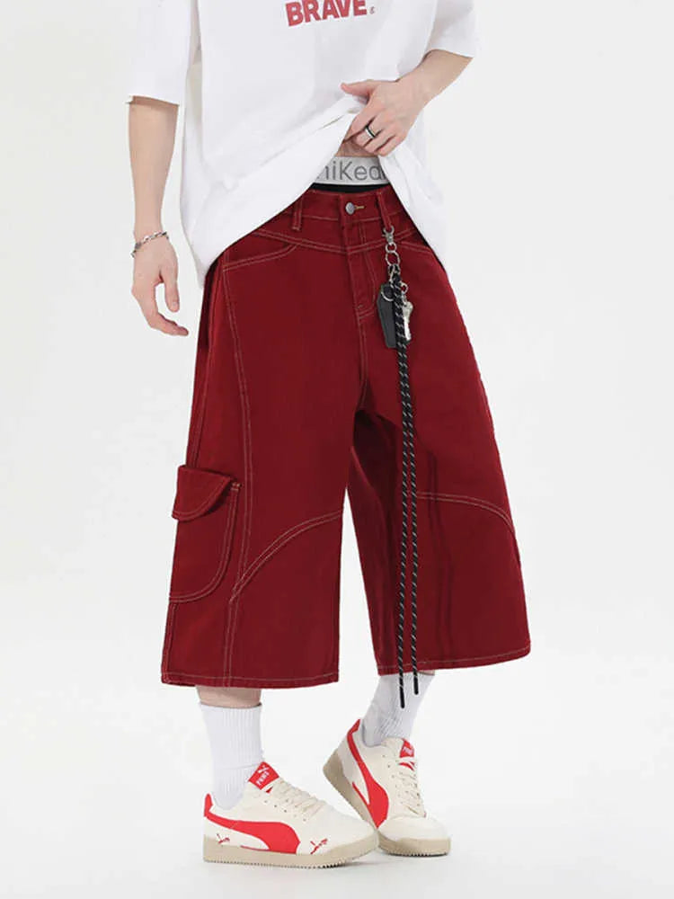 Black wide leg denim shorts with multiple pockets and cropped length on a mannequin