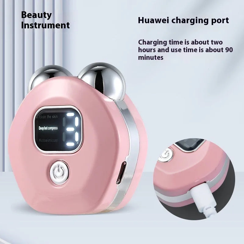 Portable white hot compress and micro current facial massage instrument with double rollers on a table.