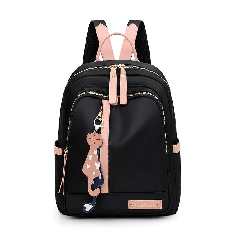 Women's black casual nylon backpack with double straps and a front pocket, shown next to a pink version.