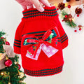 Red and green dog Christmas jumpers showing weight-based sizing from XS to XL for holiday pet wear