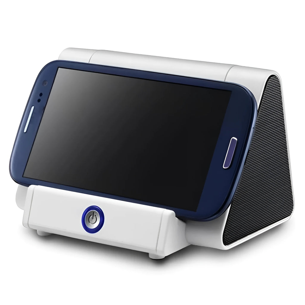 Small black and white wireless Bluetooth mini speaker with built-in charging cable.